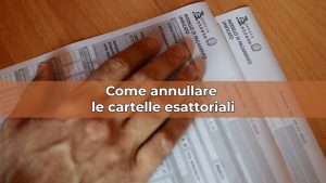Mano con documento agenzia delle entrate e scritta: "come annullare le cartelle esattoriali"