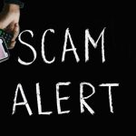 scam allert scritta